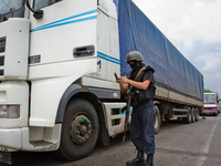 Police special opps check a truck on the road to Donetsk (