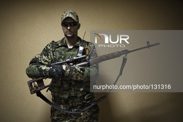 A sniper seen inside the headquarters of the Russian Orthodox Army in the occupied SBU building in Donetsk, eastern Ukraine, on May 5th, 201...