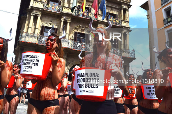 Activists From Around the World Descend on Pamplona's Main Square to Demand an End to Cruel Running of the Bulls on July 5, 2016. Wearing li...