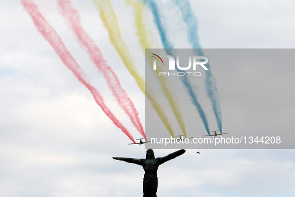 Aerobatic Yakers team makes traces on national flag colors with their YAK-52 planes during a ceremony marking Romania's Air Forces Day in Bu...