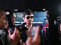 Makati, Philippines - Filipino boxing champion Manny Pacquiao arrives at a press conference in Makati, east of Manila on June 9, 2014. Manny...
