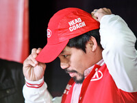 Makati, Philippines - Filipino boxing champion Manny Pacquiao wears a cap after being appointed as head coach of KIA, a new team joining the...