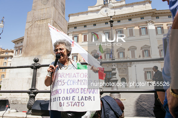 People gather in front of the Chamber of Deputees in Rome to protest the government's plan to use public funds to bail out banks, in Rome, j...