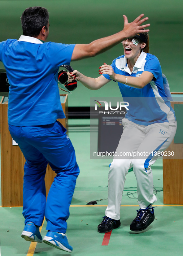 Anna Korakaki (R) of Greece celebrates with her coach, also her father after the women's 25m pistol final of shooting at the 2016 Rio Olympi...