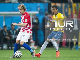 SAO PAULO BRAZIL--12 June: Luis Gustavo and Modric in the match between Brazil and Croatia in the group stage of the 2014 World Cup, for the...