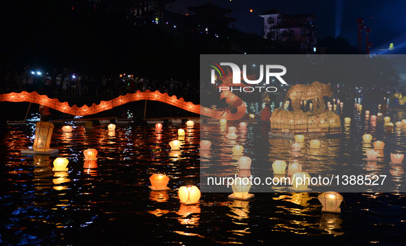 Photo taken on Aug. 16, 2016 shows lanterns in the river during a traditional lantern fair in Ziyuan County, south China's Guangxi Zhuang Au...