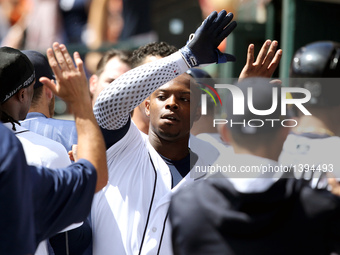 Detroit Tigers left fielder Justin Upton (8) is congratulated by teammates after his 3-run home run in the third inning of a baseball game a...