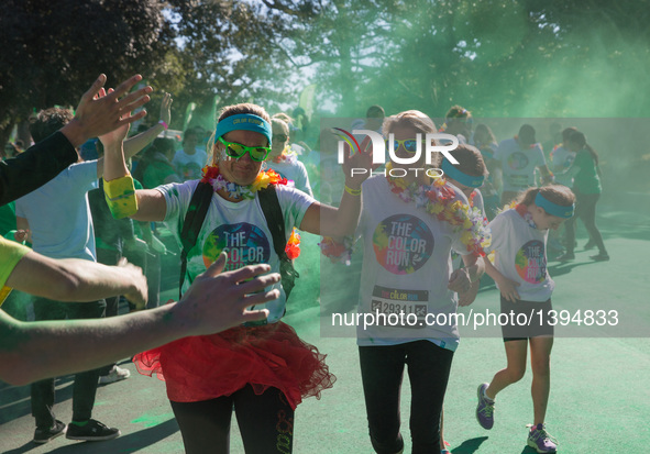 People participate in the Color Run in Sydney, Australia, on Aug. 21, 2016. The Color Run, known as 