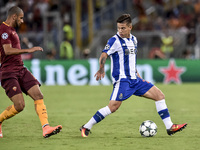 Otvio of Porto is challenged by Bruno Peres of Roma  during the match between FC Porto v AS Rome UEFA Champions League playoff match in Rome...