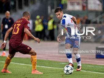 Porto's Brazilian midfielder Otavio (R) in action with Peres of Roma (L)  during the UEFA Champions League playoff match between AS Roma and...
