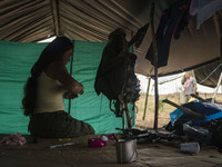 Guerrilla from FARC EP decoriating her military equipment in Llanos del Yari, a town in an Indigenous region of southern Colombia on 21 Sept...