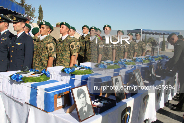 Coffins are dislayed during a handover remains ceremony at a military cemetery in Nicosia, Cyprus, on Oct. 4, 2016. Cyprus on Tuesday handed...