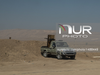Kourdish Peshmerga truck with heavy machine gun points at ISIS forces of Mosul, on October 8, 2016. Military facilities of Kurdish Peshmerga...