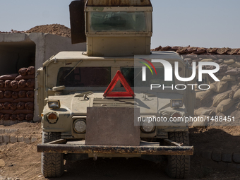 Kourdish Peshmerga truck with heavy machine gun pointing at ISIS forces of Mosul, on October 8, 2016. Military facilities of Kurdish Peshmer...