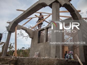 Residents have started to repair their damaged houses in village on Tapyon near Les Cayes, Haiti, on October 9, 2016.The number of people ki...