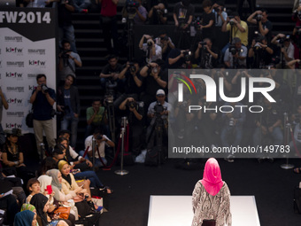 A model shows creations of respective designers during the Islamic Fashion Festival at the Malaysia International Fashion Week in Kuala Lump...