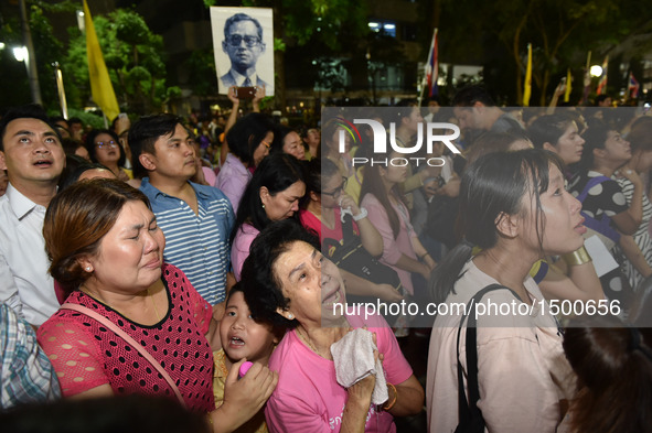 People mourn for the death of Thai King Bhumibol Adulyadej outside Siriraj Hospital in Bangkok, capital of Thailand, on Oct. 13, 2016. Thai...