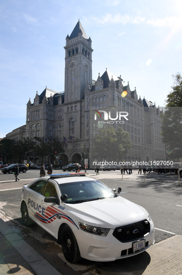 A police car is seen near the Trump International Hotel during the opening and ribbon cutting ceremony in Washington, D.C., the United State...