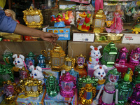 A Palestinian shop for imported traditional Ramadan lanterns at a market in Rafah in the southern Gaza Strip on June 28, 2014. Starting on S...