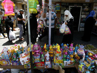 A Palestinians buys the lanterns traditional Ramadan at a market in Rafah in the southern Gaza Strip on June 28, 2014. Starting on Sunday, M...