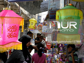 A Palestinian vendors displays imported traditional Ramadan lanterns at a market in Rafah in the southern Gaza Strip on June 28, 2014. Start...