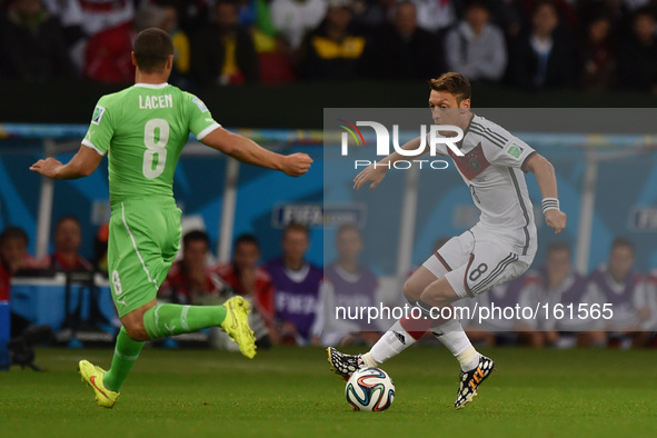 PORTO ALEGRE, 30.06.2014: BRAZIL: Mesut Ozil and Lacen in match between Germany and Algeria, corresponding to the round of the last 16 of th...