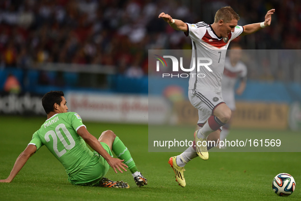 PORTO ALEGRE, 30.06.2014: BRAZIL: Schwensteiger and Mandi in match between Germany and Algeria, corresponding to the round of the last 16 of...