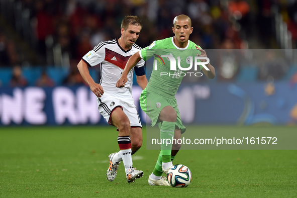 PORTO ALEGRE, 30.06.2014: BRAZIL: Philipp Lahm and Feghouli in match between Germany and Algeria, corresponding to the round of the last 16...