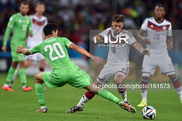 PORTO ALEGRE, 30.06.2014: BRAZIL: Mesut Ozil and Mandi in match between Germany and Algeria, corresponding to the round of the last 16 of th...
