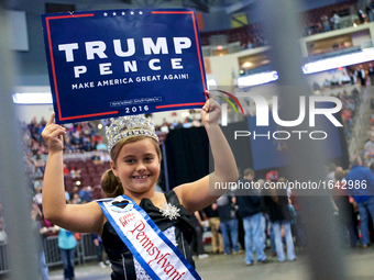 Little Miss PA East Coast USA Alexis Martz, 9, holds up a sign in support of the Republican ticket at a rally at the Giant Center in Hershey...