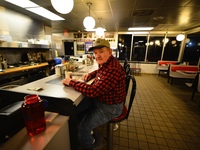 At a Frederick, Maryland, Waffle House Joe Schumacher, 77, of Middletown, Maryland is getting ready for work as the nation prepares for Inau...