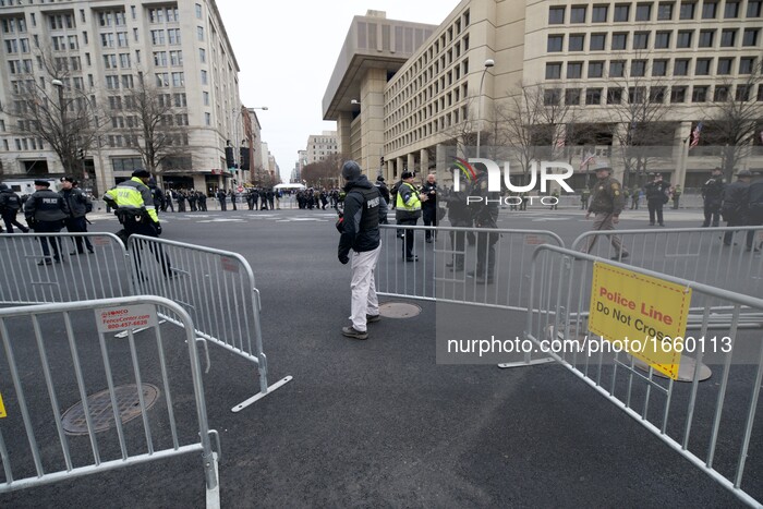 Gates that give access to the mall are closed as pgrotests and supporters gather as Donald Trump takes the oath of office and becomes the 45...