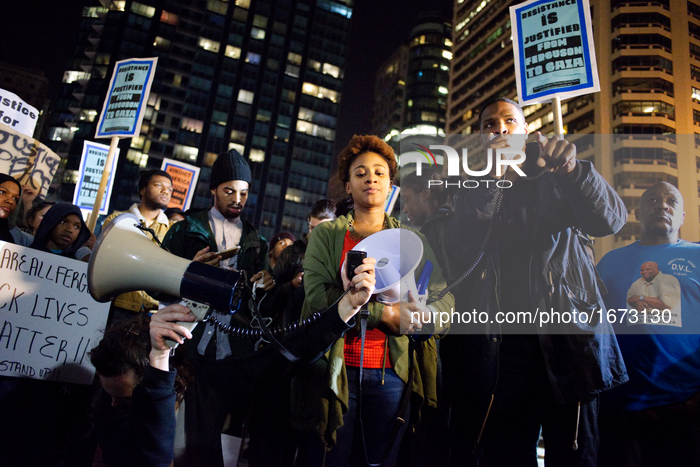 Protestors at Dillworth Park, near City Hall, Philadelphia, PA,  use a bullhorn as they react to a jury decision in the case of the 18-year...