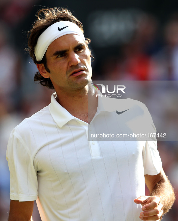 (140705) -- LONDON, July 5, 2014 () -- Roger Federer of Switzerland competes during the men's singles semifinal match against Milos Raonic o...