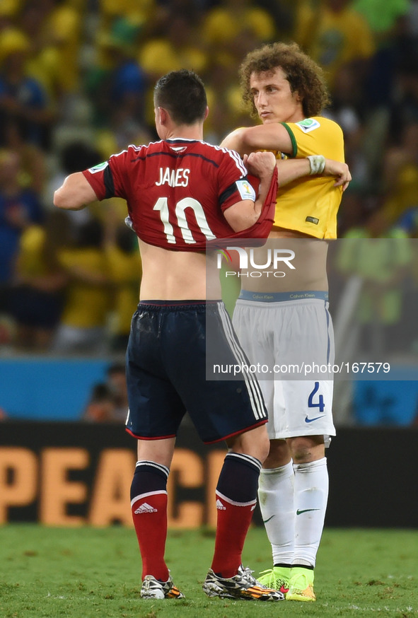 (140704) -- FORTALEZA, July 4, 2014 () -- Brazil's David Luiz (R) and Colombia's James Rodriguez exchange their jerseys after a quarter-fina...