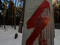 Vandals wrote in red ink inscriptions 