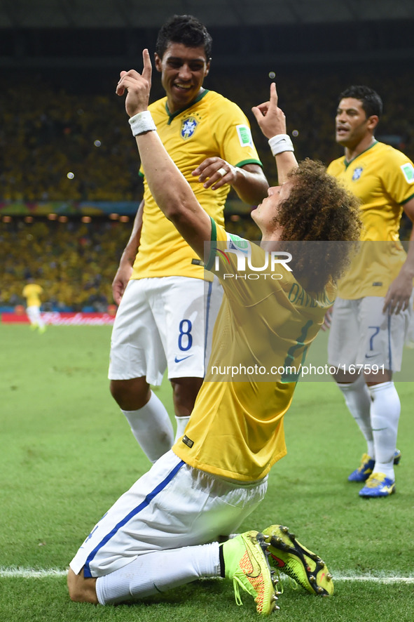(140704) -- FORTALEZA, July 4, 2014 () -- Brazil's David Luiz (front) celebrates his goal during a quarter-finals match between Brazil and C...