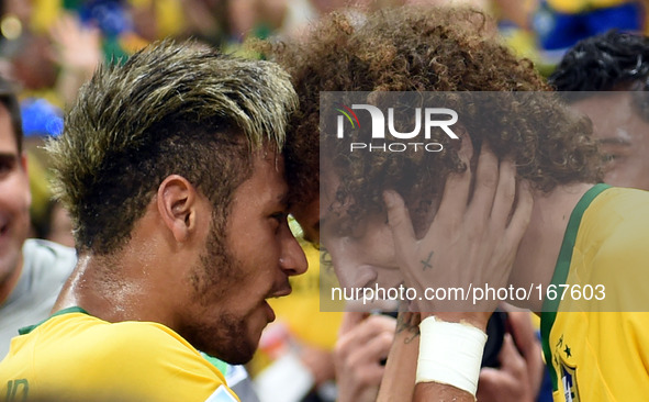 (140704) -- FORTALEZA, July 4, 2014 () -- Brazil's David Luiz (R) celebrates his goal with Neymar during a quarter-finals match between Braz...