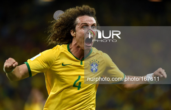 (140704) -- FORTALEZA, July 4, 2014 () -- Brazil's David Luiz celebrates his goal during a quarter-finals match between Brazil and Colombia...