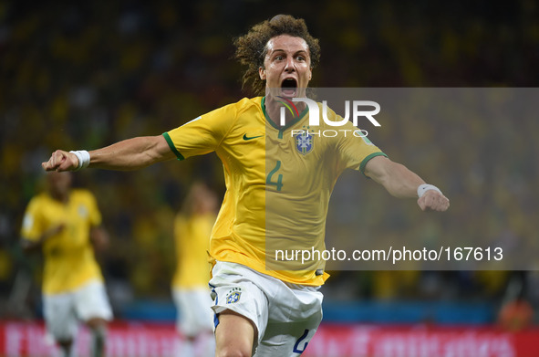 (140704) -- FORTALEZA, July 4, 2014 () -- Brazil's David Luiz celebrates his goal during a quarter-finals match between Brazil and Colombia...
