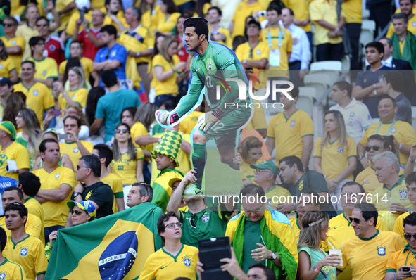 (140704) -- FORTALEZA, July 4, 2014 () -- A Brazil's fan holds a photo of Brazil's goalkeeper Julio Cesar during a quarter-finals match betw...