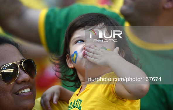 (140704) -- FORTALEZA, July 4, 2014 () -- A young supporter of Brazil reacts before a quarter-finals match between Brazil and Colombia of 20...
