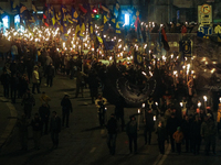 People lit up torches as they participate in a march organized by Ukrainian nationalist party Svoboda (Freedom) in Kiev on January 29, 2017,...