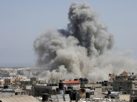 An Israeli missile hits an area in Rafah, southern Gaza Strip, Wednesday, July 9, 2014. The Israeli army on Wednesday intensified its offens...