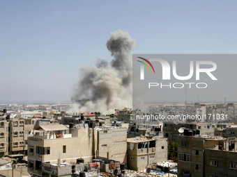 An Israeli missile hits an area in Rafah, southern Gaza Strip, Wednesday, July 9, 2014. The Israeli army on Wednesday intensified its offens...