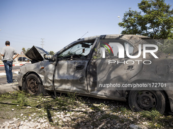 A car damaged by a rocket fired from Gaza into the city of Sderot, in southern Israel, on July 10th, 2014. (