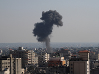 Smoke rises after an attack of Israeli aircraft in Gaza City on 10 July 2014. (