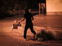 Bahrain , Abu Saiba - protester running with molotov cocktail during the clashes with riot police ,  demonstration with title 