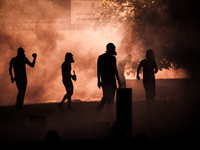 Bahrain , Abu Saiba - protesters during the clashes with riot police , demonstration with title 