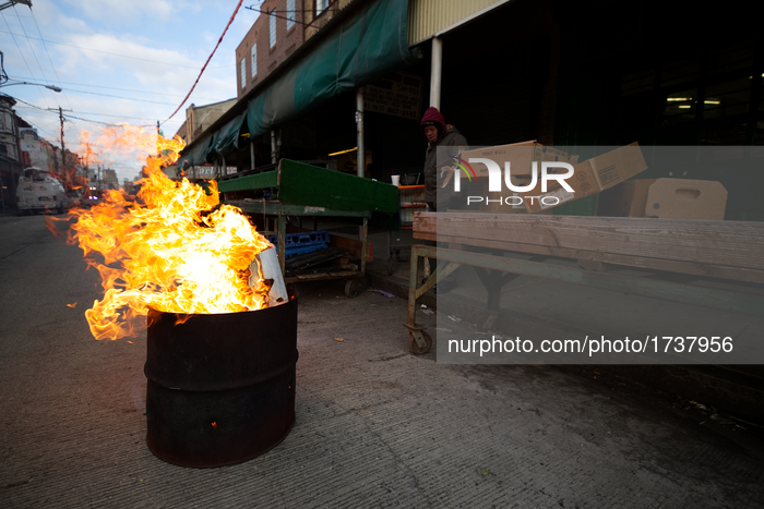 At the end of the day cardboard boxes end up in a fire pit at the Italian Market, in Philadelphia, PA, USA, on February 16th, 2017. Several...